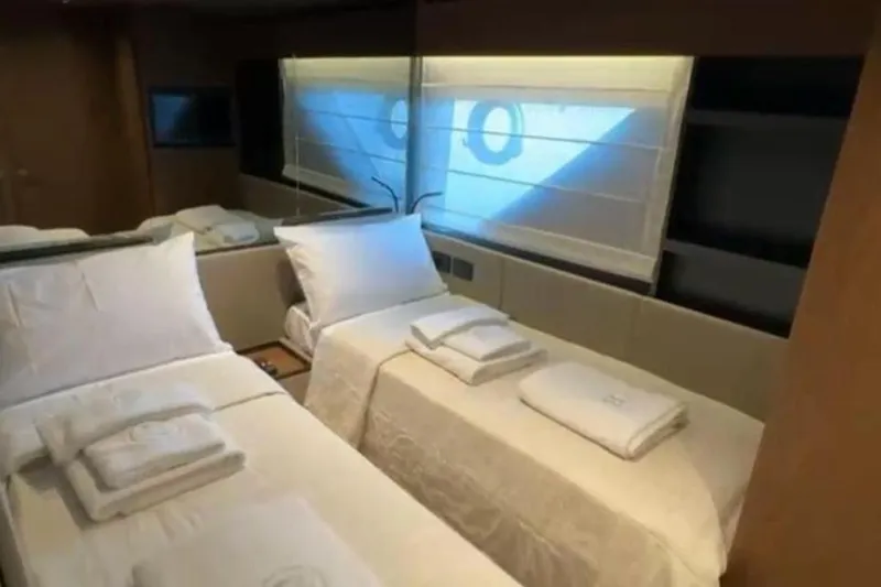 Yacht Photos Pics Luxurious cabin interior of 2025 Bluegame BG74 yacht with twin beds and elegant decor.