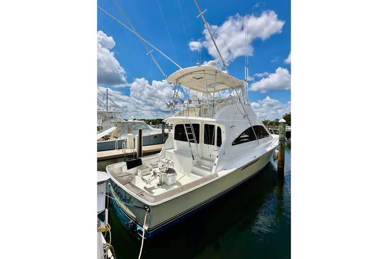 Gold Coast Yacht Photos Pics 2005 Ocean Yachts 50 Super Sport docked under a bright blue sky.