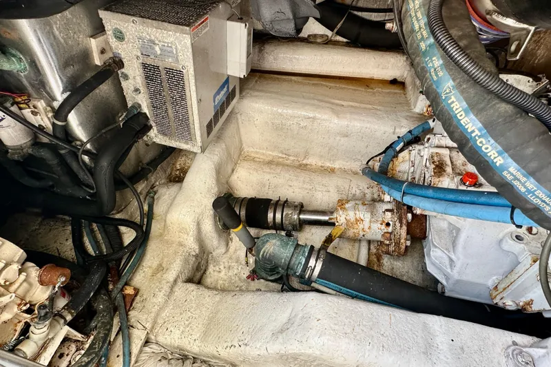 Gold Coast Yacht Photos Pics Engine room of 2005 Ocean Yachts 50 Super Sport with visible mechanical components and hoses.