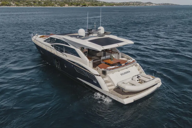 Scuderia Yacht Photos Pics Luxury 2010 Absolute 70 STY yacht cruising on open water, rear view.