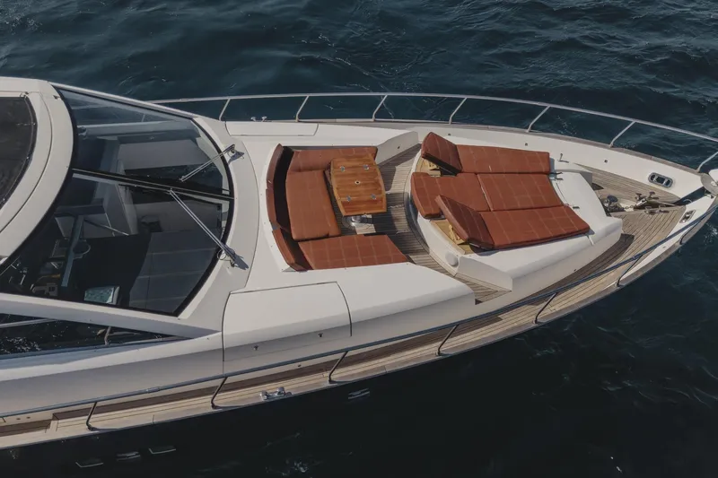 Scuderia Yacht Photos Pics Luxury Absolute 70 STY yacht deck with sun loungers, 2010 model, on open water.