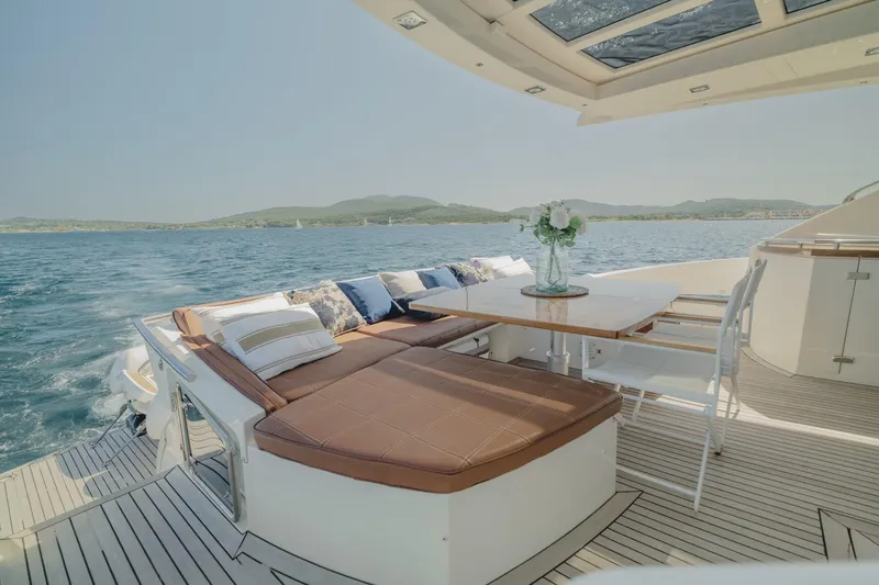 Scuderia Yacht Photos Pics Luxurious 2010 Absolute 70 STY yacht deck with seating and ocean view.