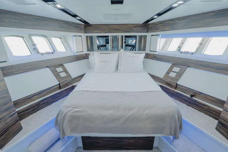 Scuderia Yacht Photos Pics Luxurious bedroom interior of 2010 Absolute 70 STY yacht with modern design and ample natural light.
