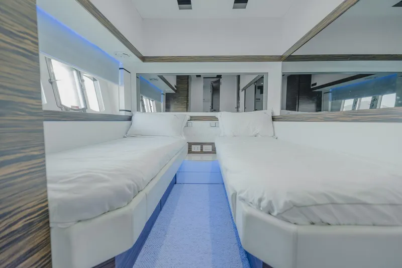 Scuderia Yacht Photos Pics Luxurious twin bedroom in 2010 Absolute 70 STY yacht with modern design and ambient lighting.