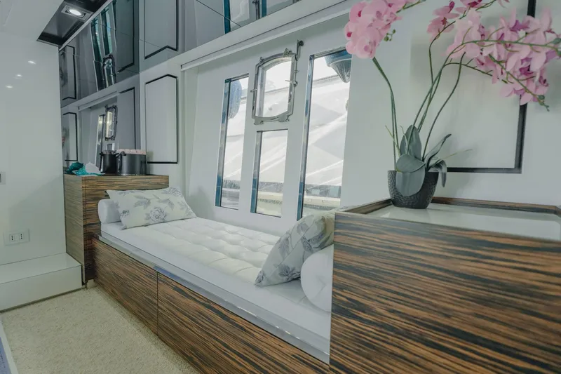 Scuderia Yacht Photos Pics Luxurious interior of 2010 Absolute 70 STY yacht with elegant seating and floral decor.