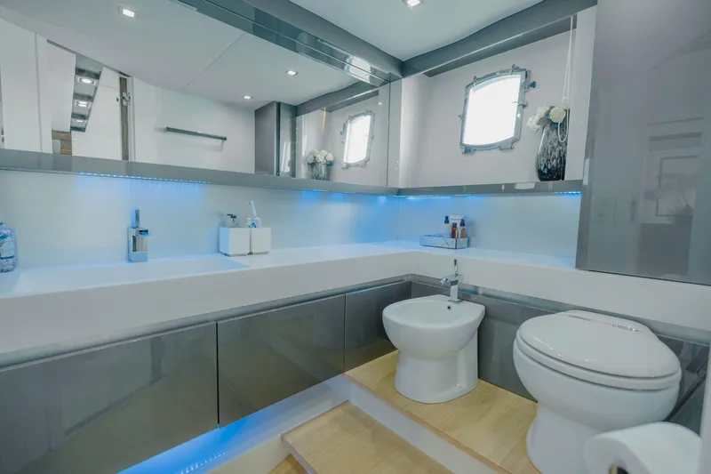 Scuderia Yacht Photos Pics Luxurious bathroom in 2010 Absolute 70 STY yacht with modern fixtures and ambient lighting.