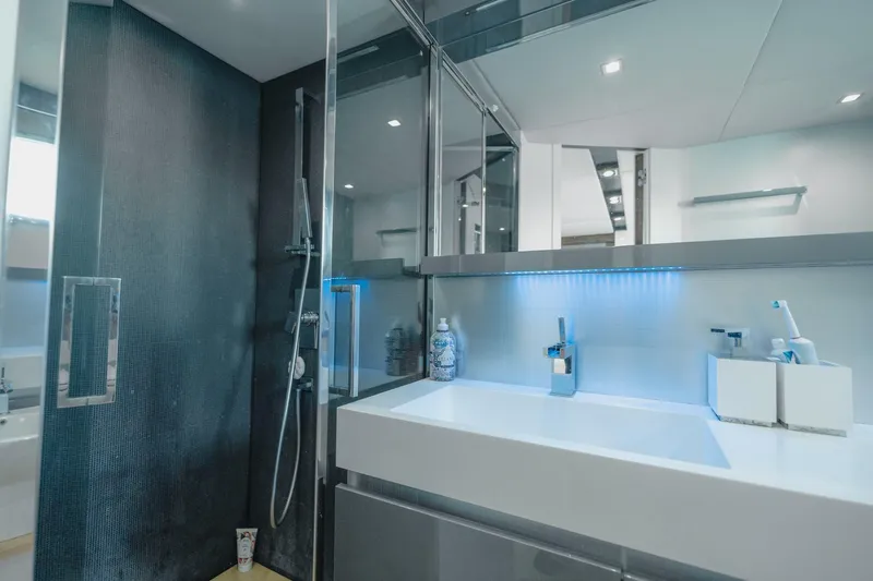 Scuderia Yacht Photos Pics Luxurious bathroom in 2010 Absolute 70 STY yacht with modern fixtures and sleek design.