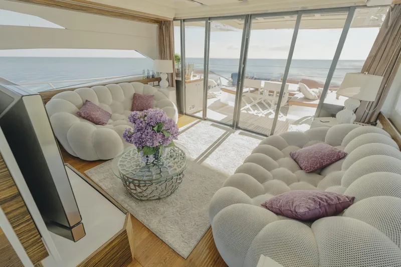 Scuderia Yacht Photos Pics Luxurious interior of 2010 Absolute 70 STY yacht with plush seating and ocean view.