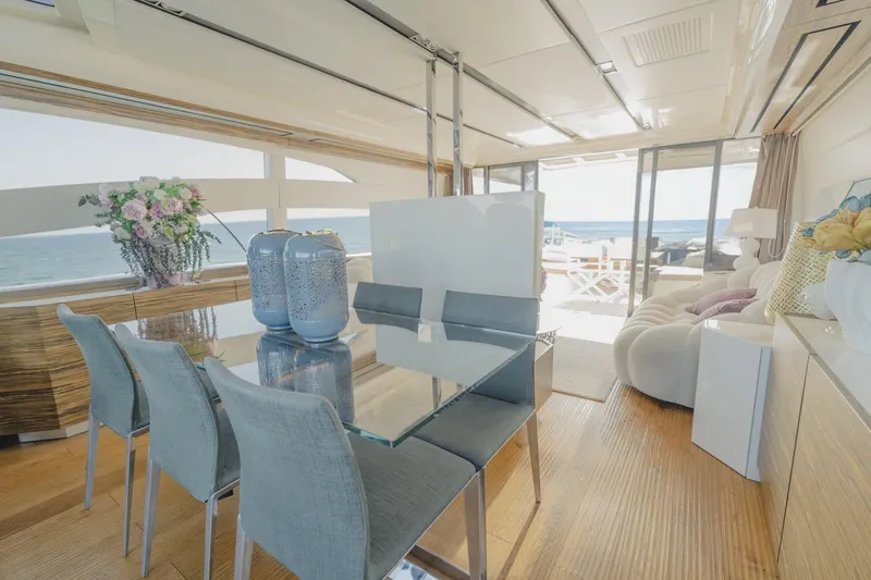 Scuderia Yacht Photos Pics Luxurious interior of 2010 Absolute 70 STY yacht with elegant dining area and ocean view.