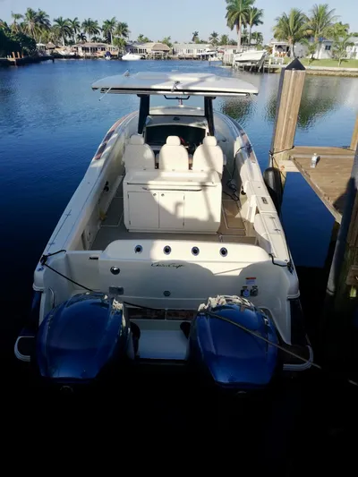  Yacht Photos Pics 2019 Chris-Craft Catalina 34 docked in a serene waterfront setting.