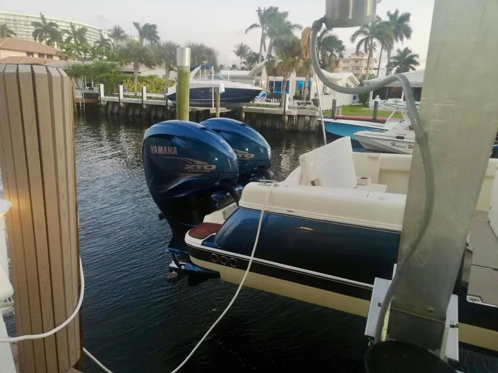  Yacht Photos Pics 2019 Chris-Craft Catalina 34 with Yamaha engines docked by palm trees.