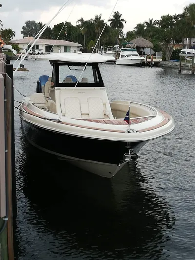  Yacht Photos Pics 2019 Chris-Craft Catalina 34 boat docked on a calm waterway.