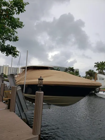  Yacht Photos Pics 2019 Chris-Craft Catalina 34 boat covered and docked under cloudy skies.