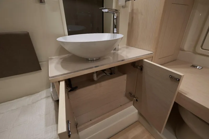  Yacht Photos Pics 2019 Chris-Craft Catalina 34 bathroom with modern sink and open cabinet.