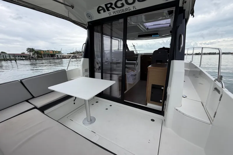  Yacht Photos Pics 2019 Jeanneau NC 895 boat with seating area and table, docked in St. Petersburg, FL.