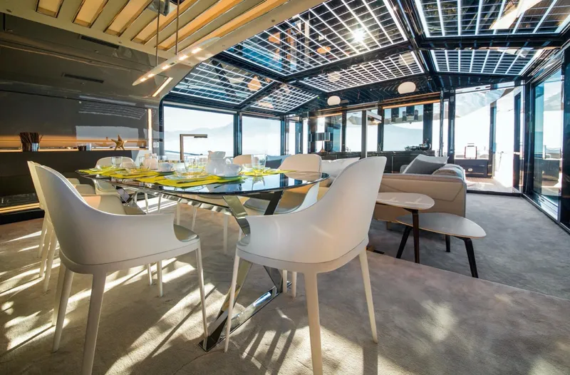  Yacht Photos Pics Luxurious interior of 2015 Arcadia Yachts A 85 with modern dining area and panoramic views.