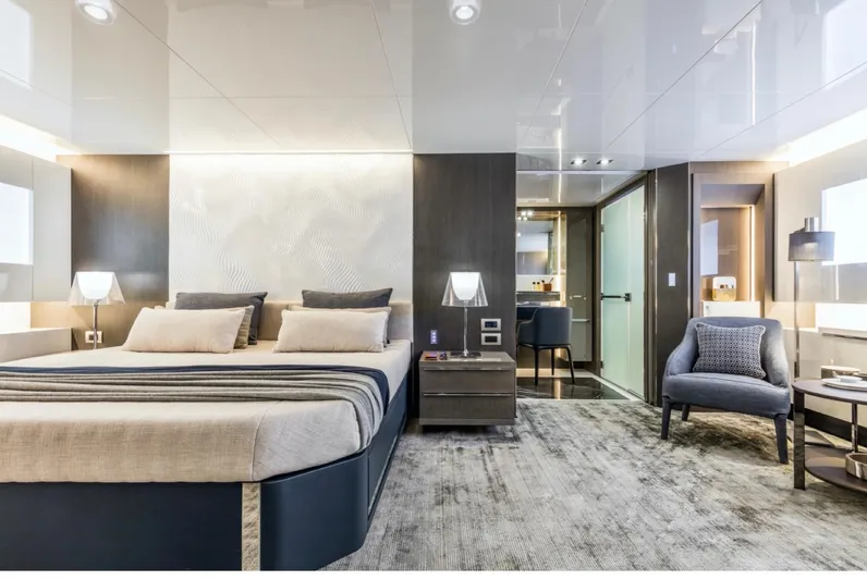 Yacht Photos Pics Luxurious bedroom interior of 2015 Arcadia Yachts A 85, featuring modern design and elegant furnishings.