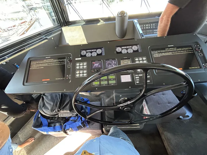  Yacht Photos Pics Cockpit of 2015 Arcadia Yachts A 85 with navigation controls and steering wheel.