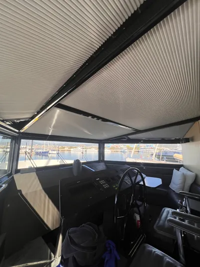  Yacht Photos Pics Interior view of 2015 Arcadia Yachts A 85 helm with modern design and panoramic windows.