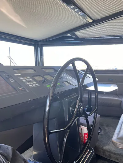  Yacht Photos Pics Interior helm of 2015 Arcadia Yachts A 85, featuring modern controls and steering wheel.