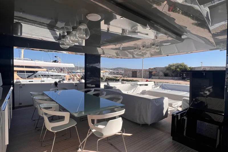  Yacht Photos Pics Luxurious 2015 Arcadia Yachts A 85 interior with modern dining area and scenic marina view.