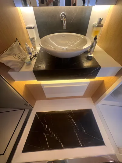  Yacht Photos Pics Luxurious bathroom sink area on 2015 Arcadia Yachts A 85, featuring modern design and elegant lighting.