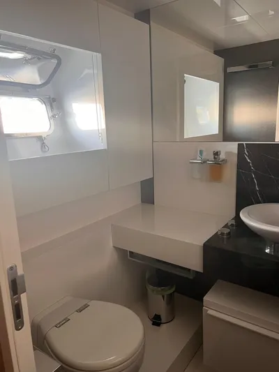  Yacht Photos Pics Luxurious bathroom on 2015 Arcadia Yachts A 85, featuring modern fixtures and sleek design.