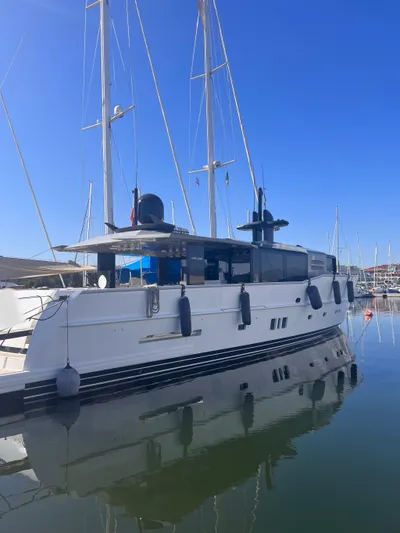  Yacht Photos Pics 2015 Arcadia Yachts A 85 luxury yacht docked in a marina under clear blue skies.