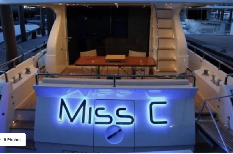 Miss C Yacht Photos Pics Aft view of 2009 Uniesse 65 MY yacht, illuminated with "Miss C" signage.