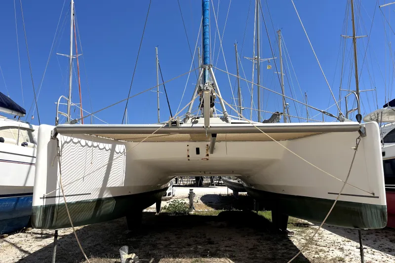  Yacht Photos Pics 2002 Fountaine Pajot LAVEZZI 40 catamaran on dry dock under clear blue sky.