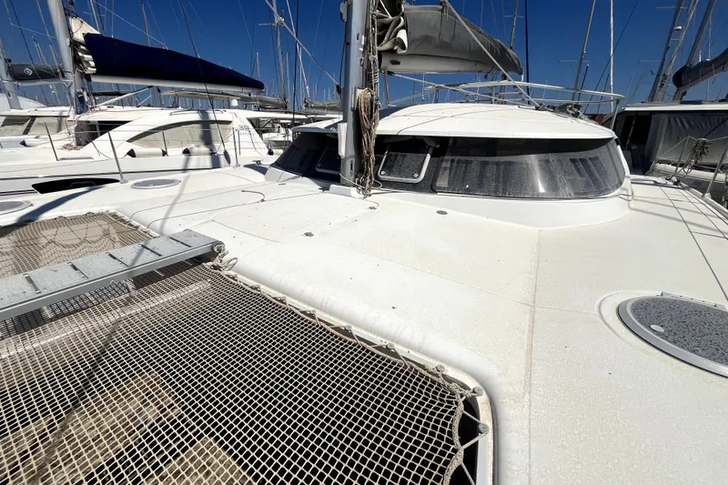  Yacht Photos Pics 2002 Fountaine Pajot LAVEZZI 40 catamaran deck with netting and sails.