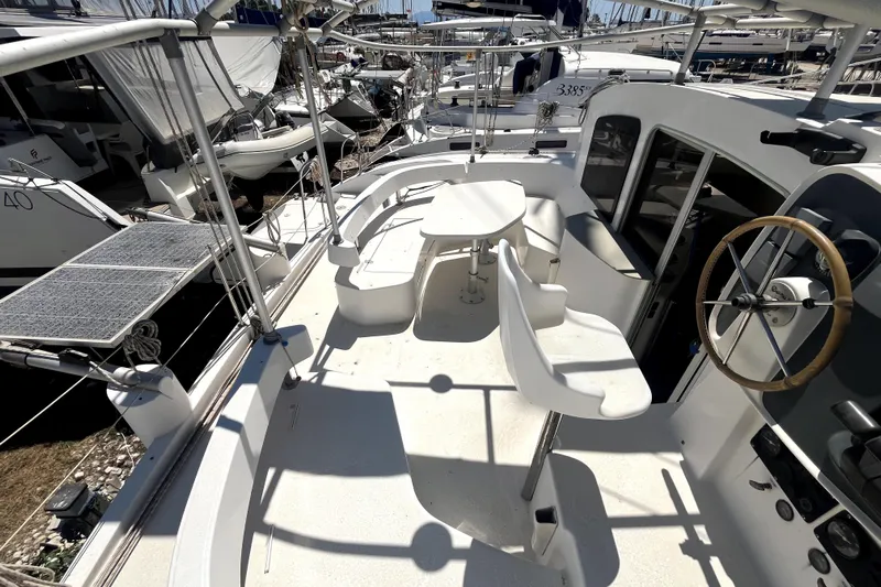  Yacht Photos Pics 2002 Fountaine Pajot LAVEZZI 40 catamaran cockpit with steering wheel and seating area.