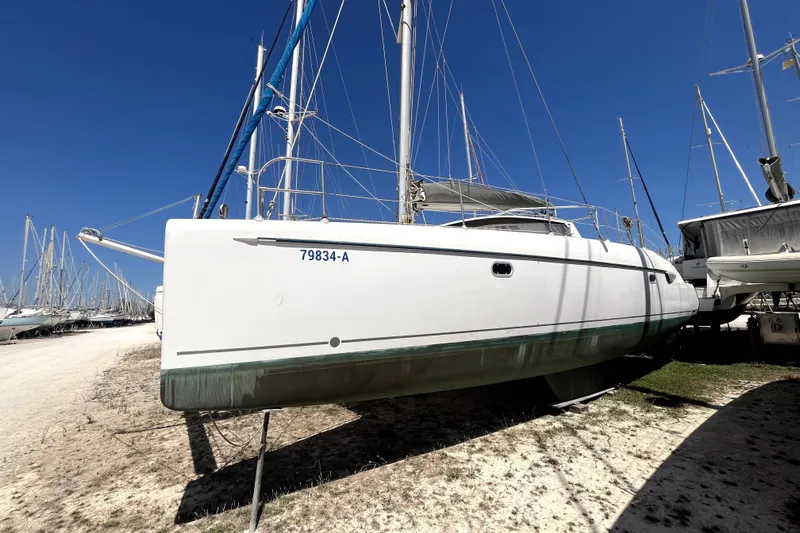  Yacht Photos Pics 2002 Fountaine Pajot LAVEZZI 40 catamaran on land, clear blue sky background.