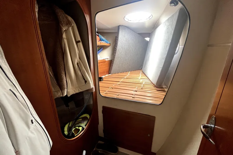  Yacht Photos Pics Interior cabin of 2002 Fountaine Pajot LAVEZZI 40 catamaran with storage and bedding.