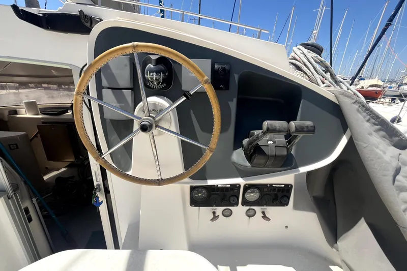  Yacht Photos Pics Helm of 2002 Fountaine Pajot LAVEZZI 40 catamaran with steering wheel and controls.