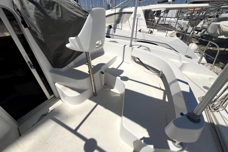  Yacht Photos Pics Deck view of 2002 Fountaine Pajot LAVEZZI 40 catamaran with seating and helm station.