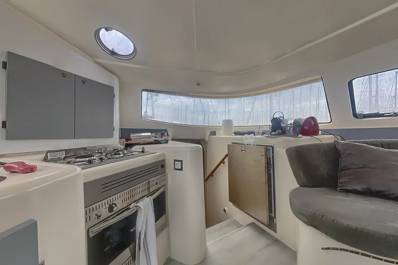 Yacht Photos Pics Interior of 2002 Fountaine Pajot LAVEZZI 40 catamaran with kitchen and seating area.