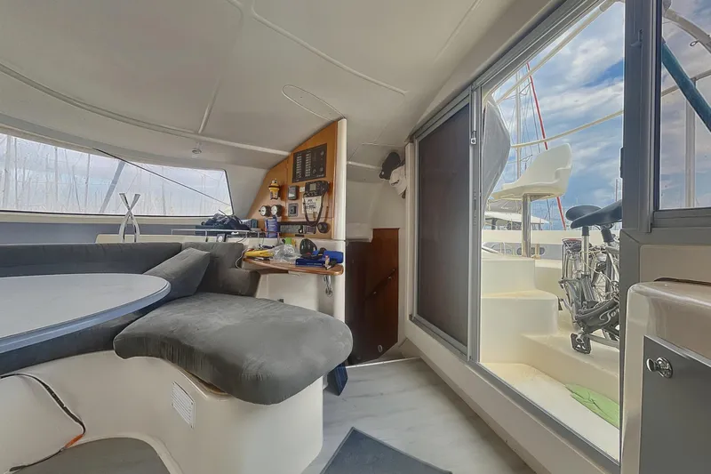  Yacht Photos Pics Interior of 2002 Fountaine Pajot LAVEZZI 40 catamaran with seating and navigation area.