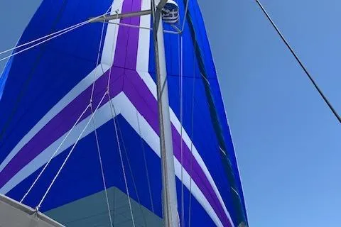 Yacht Photos Pics Sail of 2002 Fountaine Pajot LAVEZZI 40 catamaran with vibrant blue and purple design.