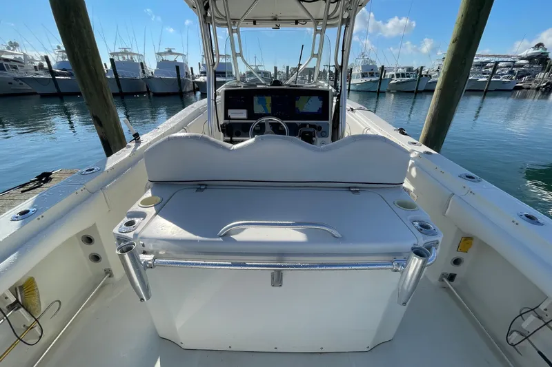  Yacht Photos Pics 2003 Hydra-Sports Vector 3300 CC boat interior at marina, featuring helm and seating area.