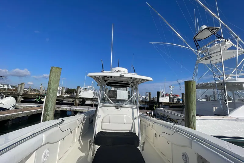  Yacht Photos Pics 2003 Hydra-Sports Vector 3300 CC boat docked at marina under clear blue sky.