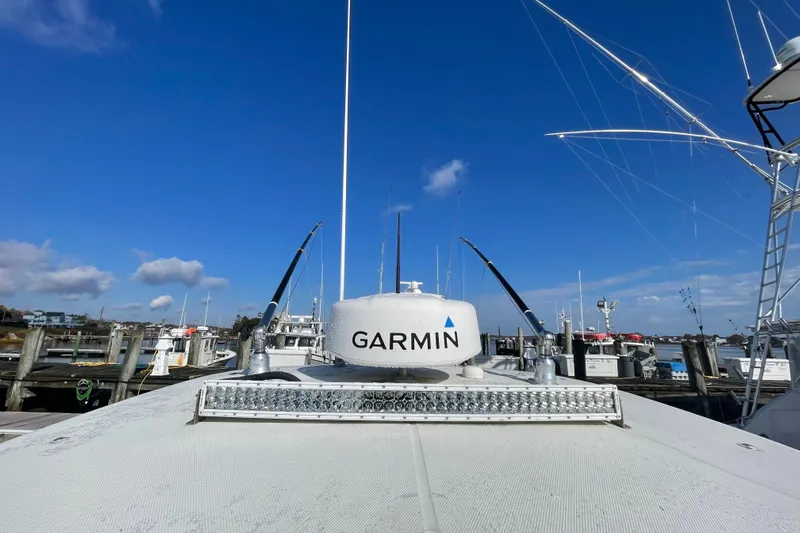  Yacht Photos Pics 2003 Hydra-Sports Vector 3300 CC with Garmin radar at marina under clear blue sky.