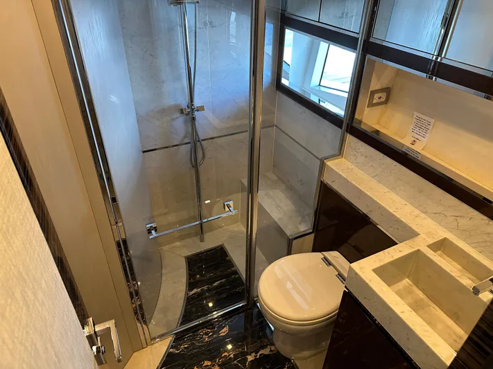 Bbella Yacht Photos Pics Luxurious bathroom in 2014 Cheoy Lee Alpha 87 Express Sportbridge yacht with modern fixtures.