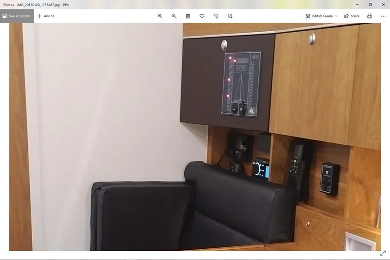  Yacht Photos Pics Interior of 2017 Hanse HANSE 415 yacht with control panel and seating area.