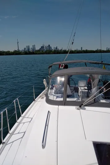  Yacht Photos Pics Sailing on a 2017 Hanse HANSE 415 yacht with city skyline in the background.