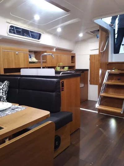  Yacht Photos Pics Interior of 2017 Hanse HANSE 415 yacht with modern wood finish and sleek design.