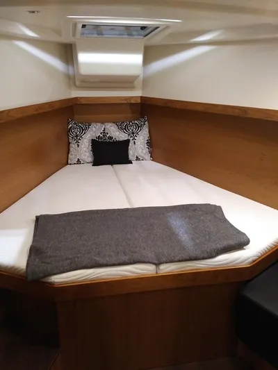  Yacht Photos Pics 2017 Hanse 415 yacht cabin with cozy bed, pillows, and blanket.