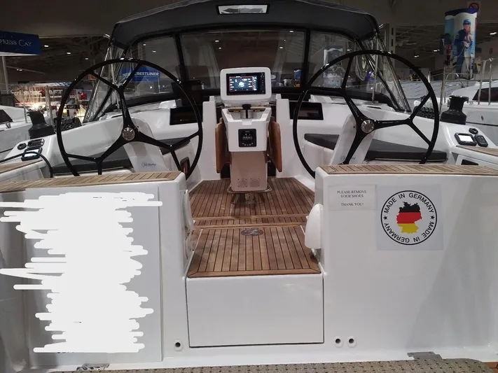  Yacht Photos Pics 2017 Hanse HANSE 415 yacht cockpit with dual steering wheels and navigation system.