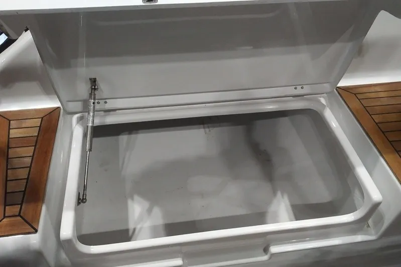  Yacht Photos Pics Open storage compartment on 2017 Hanse HANSE 415 yacht with wooden accents.