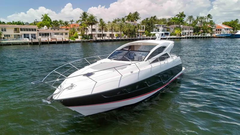 Arbitrage Yacht Photos Pics Luxury Sunseeker Predator 57 yacht cruising near waterfront homes, 2017 model.